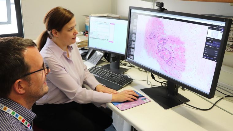 Associate Professor Clare Verrill and colleague using the AI pathology software