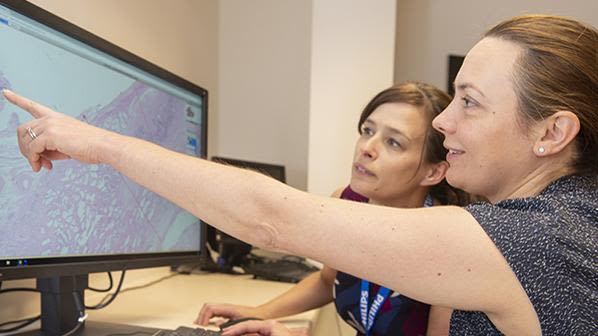 Dr Lisa Browning and Professor Clare Verrill, Honorary Consultant in Cellular Pathology at Oxford University Hospitals working with Philips IntelliSite Pathology Solution’s Image Management System.