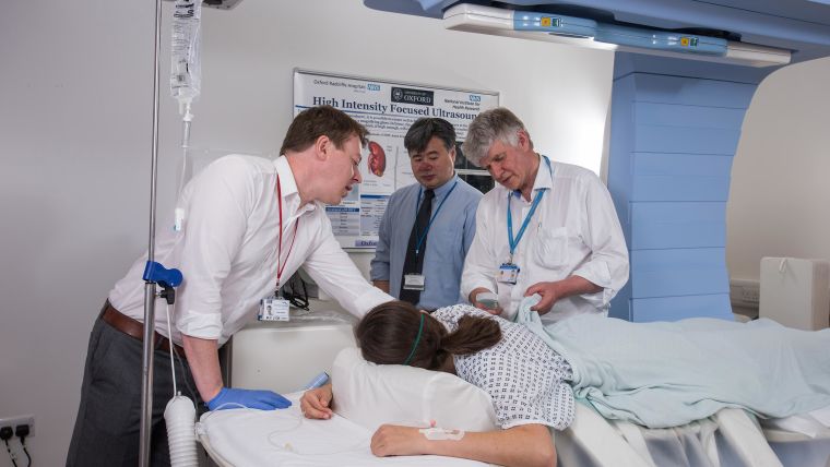 Dr Paul Lyon, Professor Feng Wu and Professor David Cranston with a patient in the High Intensity Focused Ultrasound (HIFU) unit at the Churchill Hospital.